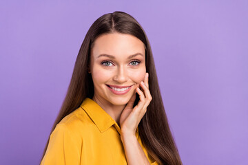 Photo of sweet young lady touch face wear yellow shirt isolated on vivid violet color background