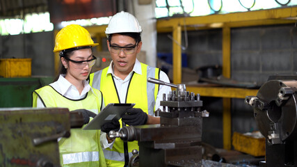 asian industrial Engineer manager man demonstration and training mechanic worker woman operating...
