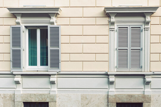 Details of European classic style window panels on an old building along street of Rome in Italy reflecting Italian elegant architectural style