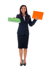 Smiling asian modern business woman holding two books and looking at camera, full length portrait isolated on white background.
