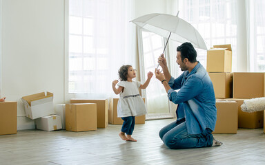Handsome adult beard Caucasian father and little cute daughter moving new house, home or apartment,...