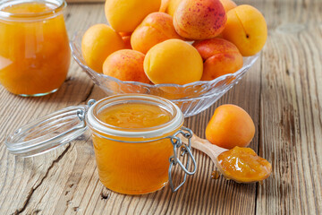 Fototapeta na wymiar Homemade apricot jam in jars. Homemade preserves concept