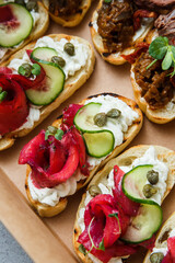 
A set of different snacks for a party or a festive table. Ciabatta sandwiches with tomatoes,...