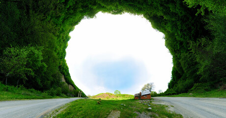 Stereographic panoramic projection of a house in the forest. 360 degree panorama.