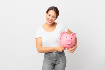young hispanic woman with a piggy bank