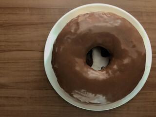 Homemade chocolat cake on a wooden board - top view