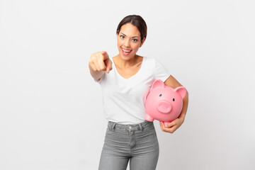 young hispanic woman with a piggy bank