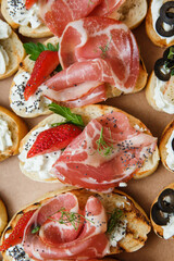 
A set of different snacks for a party or a festive table. Ciabatta sandwiches with tomatoes,...