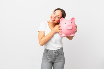 young hispanic woman with a piggy bank