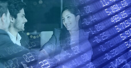 Composition of stock market over diverse group of businesspeople in modern office