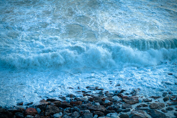 photo with sea wave and pebbles