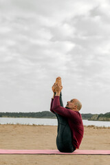 man doing Urdhva Mukha Paschimottanasana or face-up clamp pose, mantra and yoga posture. Doing...