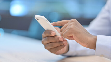 Close up of African Businessman using Smartphone