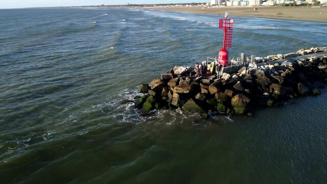 Fishermen at the lighthouse at dawn