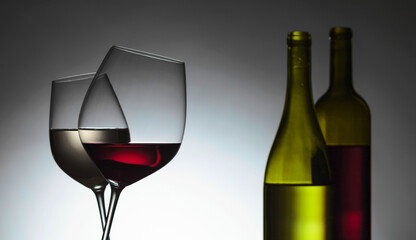Bottles and glasses of red and white wine.