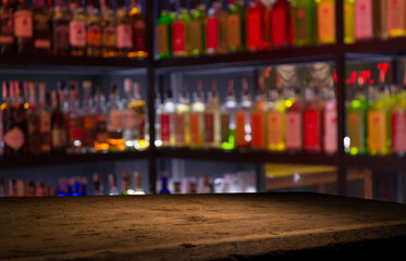 Classic bar counter with bottles in blurred background
