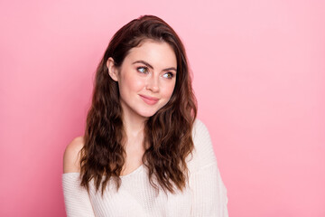 Portrait of adorable glad girl smile look empty space thinking wear pullover isolated on pink color background