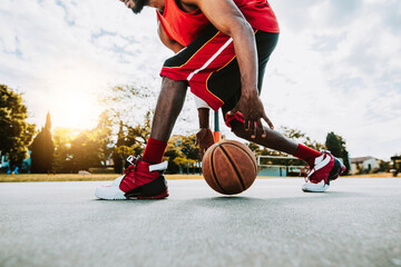 Basketball street player dribbling with ball on the court - Streetball, training and activity...