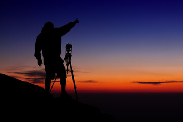 Photographer silhouette at sunset