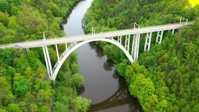 Bechyne Bridge or Bechyne Rainbow, rarely Rainbow Bridge is a unique reinforced concrete arch bridge over the river Luznice. Aerial view to monument in Czech Republic, Central Europe.