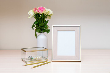 Portrait white with gold picture frame mockup and jewelry box