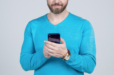cropped man with beard chatting online on smartphone, communication