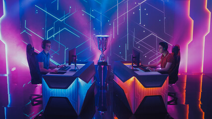 Two Esport Gamers Competition in a Video Game on a Championship Arena. Two Boys Playing Computer in...