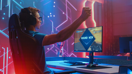 Professional eSports Gamer Plays Mock-up 3D First Person Shooter Video Game His Personal Computer,...