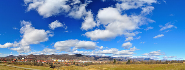 Spring landscape after rain, blue sky and clouds