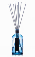 Aroma sticks in glass bottle isolated on white background. Aroma diffuser. Home fragrance.