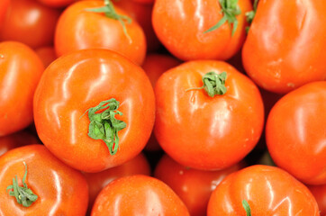 Fresh tomatoes in a market stall.