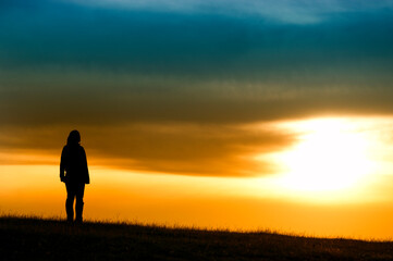 Fototapeta na wymiar Silhouette of girl in sunset.