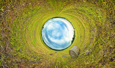 Stereographic projection of a a hay bale field. 360 degree panorama. Tunnel panorama.
