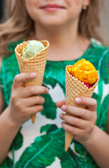 Cute kid girl eating ice cream cone