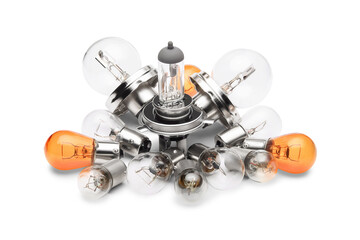 Pile of different car light bulbs isolated on white background, close up.