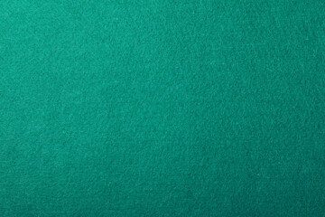 Texture of green billiard table as background, top view
