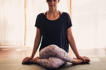 woman meditating in yoga lotus position