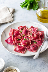 Beet ravioli with ricotta cheese, spinach and nuts. Healthy eating. Vegetarian food. Italian...