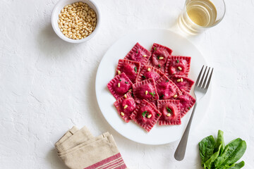 Beet ravioli with ricotta cheese, spinach and nuts. Healthy eating. Vegetarian food. Italian cuisine.
