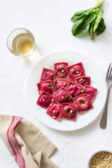 Beet ravioli with ricotta cheese, spinach and nuts. Healthy eating. Vegetarian food. Italian cuisine.