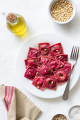 Beet ravioli with ricotta cheese, spinach and nuts. Healthy eating. Vegetarian food. Italian cuisine.