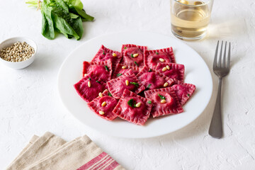 Beet ravioli with ricotta cheese, spinach and nuts. Healthy eating. Vegetarian food. Italian cuisine.