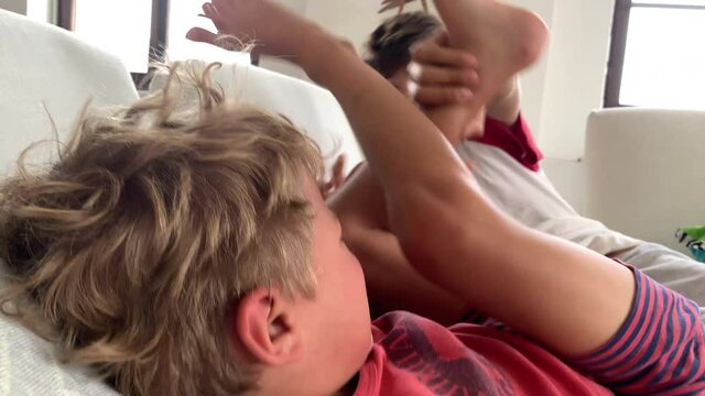 Young brothers fighting each other. Siblings quarrel