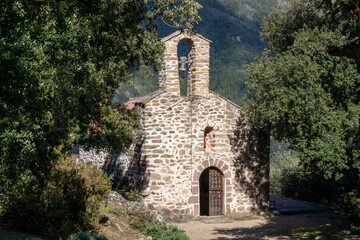 Fototapeta premium Santa Engracia small chapel lost in the catalan mountain between oak cork
