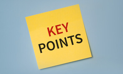 Words KEY POINTS written on sticker against blue background