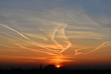 contrails at sunset