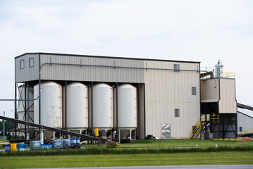 Fototapeta na wymiar Grain storage complexes corn farm grain dryer modern