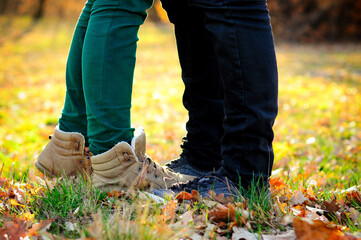 Fototapeta na wymiar Young happy couple in love, standing on the grass
