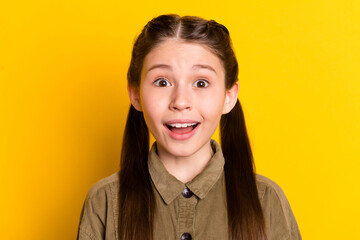 Fototapeta premium Photo portrait of small girl staring amazed opened mouth isolated on vibrant yellow color background