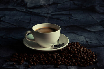 Hot espresso coffee on dark background.